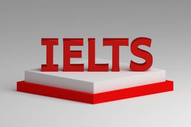 IELTS exam concept. Large bold shiny red letters IELTS on red white pedestal. 3d illustration.
